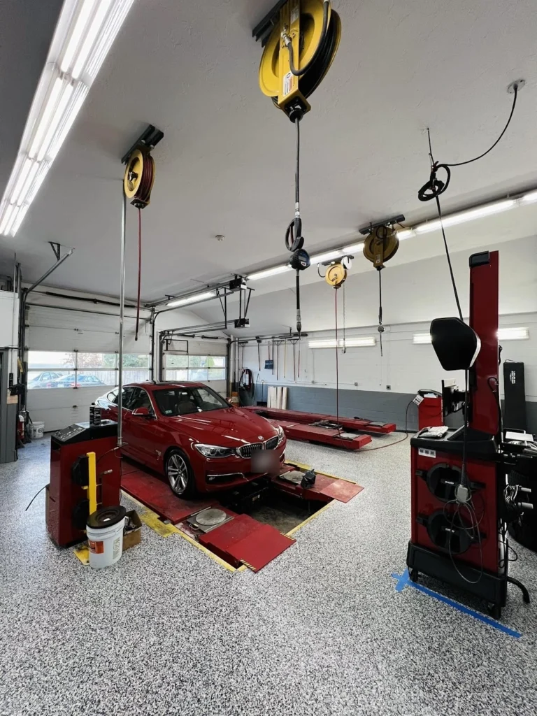 Diamond grinding a garage floor to prep it for epoxy coating in Boston