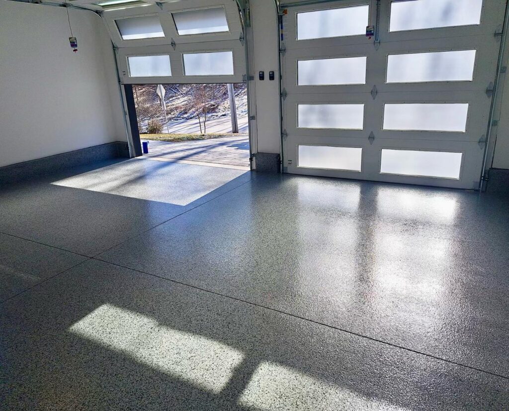Freshly coated epoxy garage floor curing before use