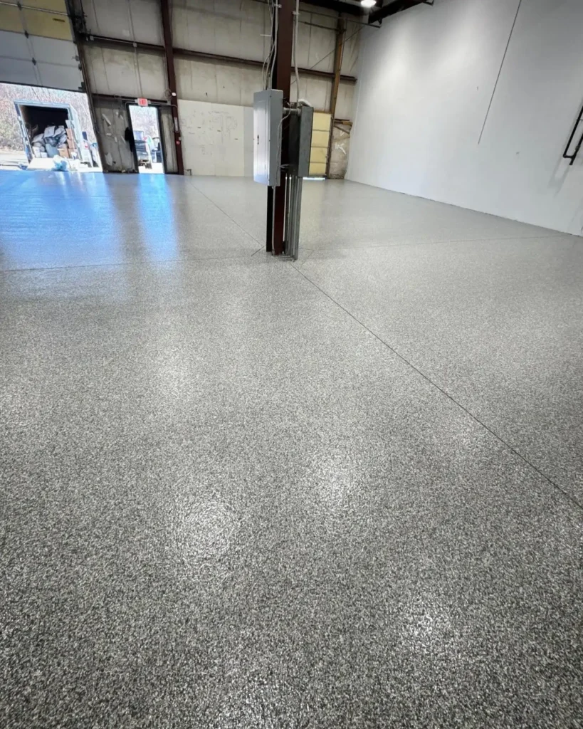 Durable flake epoxy garage floor coating in a Boston home